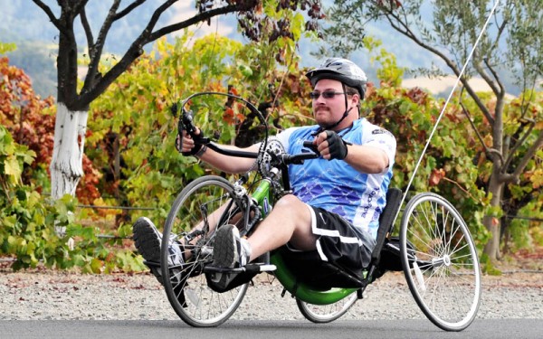 Big Sam rides a handcycle at the Rev