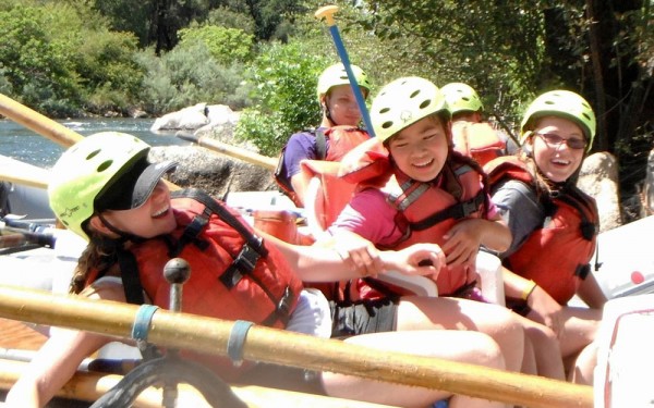 Junior Adventurers share a laugh in a whitewater raft