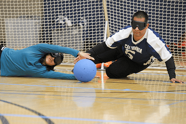 Goalball player defends the goal
