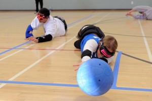 Goalball players diving on floor to make a save
