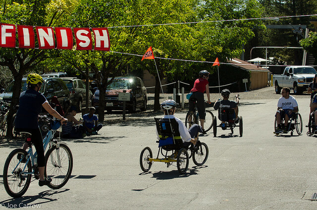 Cyclists cross the Finish Line at the 2014 Revolution Ride