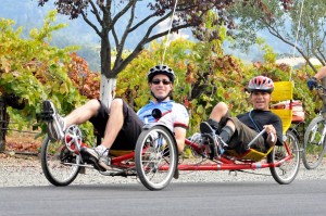 Dan & Danny ride a recumbent tandem cycle at the Rev