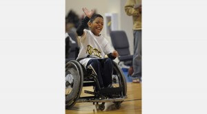 A youth basketball player laughs during a tournament