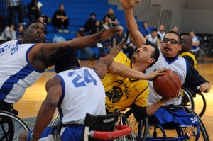 BORP defenders triple team an oppenent during a wheelchair basketball game