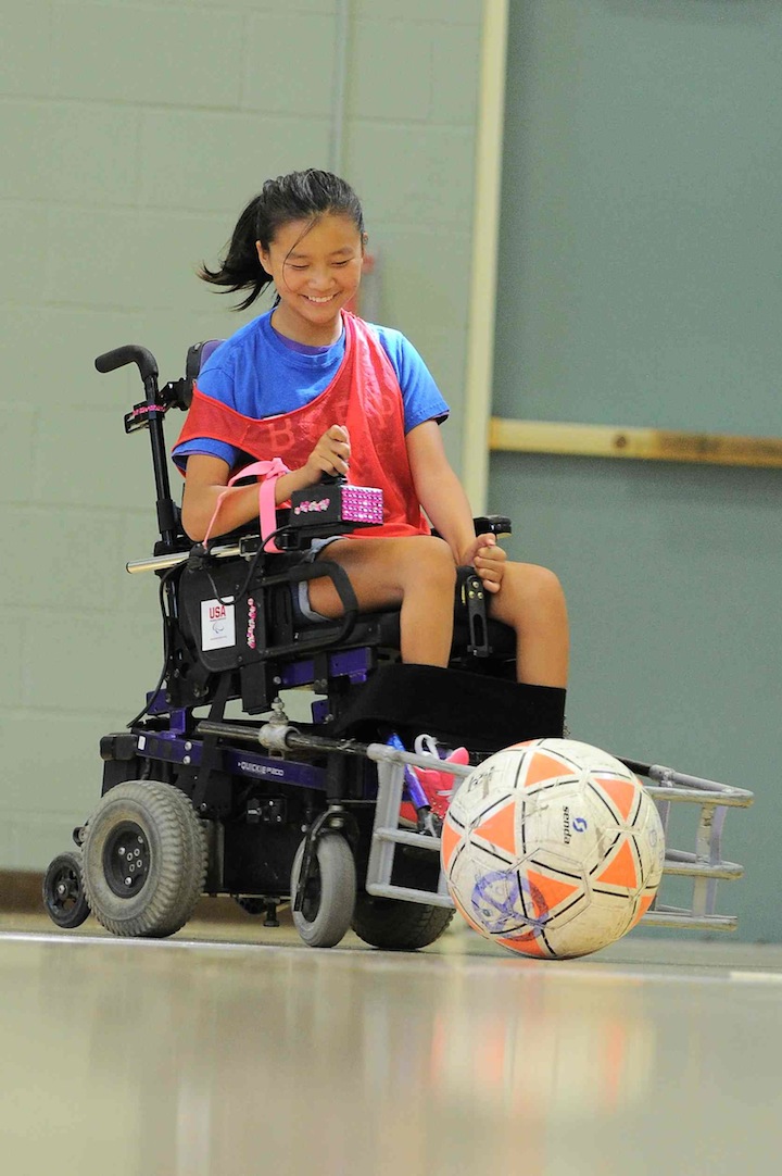 Ruby is all smiles while playing power soccer