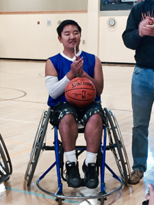 Matthew with basketball signed by the Warriors