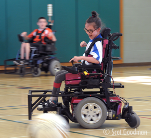 April playing power soccer