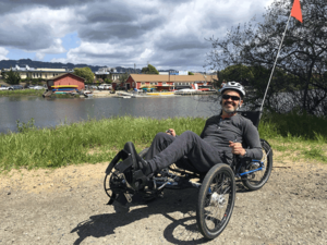 CNS “graduate” Ray Ydoyaga on a recumbent trike near the BORP Cycling Center