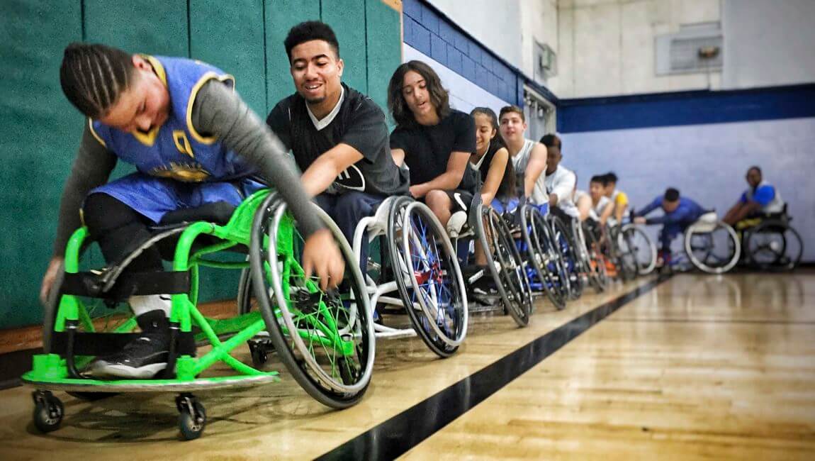 Youth line up for basketball drills