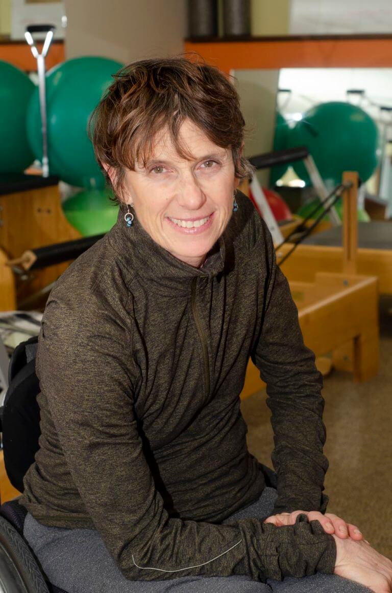 Lizanne Addicott smiling in pilates studio