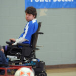John Madigan using power soccer chair