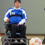 John Madigan using power soccer chair