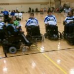 Power soccer athletes on court