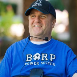 Chris Finn smiling in BORP power soccer t-shirt